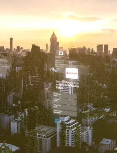 Still frame from ClearScore's 'For Free. Forever' Launch Film. A Cityscape during sunrise, with transparent phone screens in the sky displaying different interfaces.