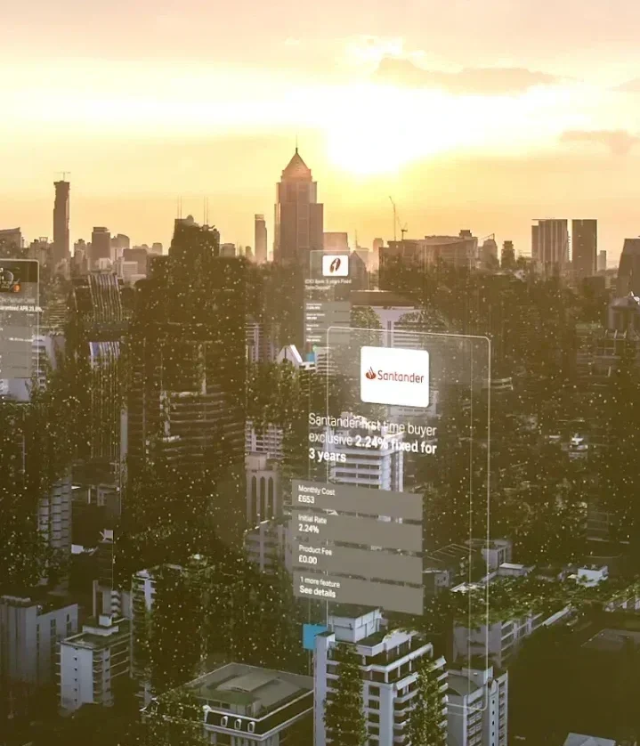 Still frame from ClearScore's 'For free. Forever' launch film. Sunset skyline of a city, with transparent, mobile screenshots from the ClearScore app floating in the air.