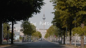 Titular still frame from episode 1 of 'The Pursuit' for SCIEX. Backdrop of Berlin, Germany.