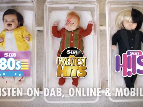 Still frame from our 'Born to Party' TVC for The Scottish Sun. Top down view of 3 babies in hospital cribs. The baby on the left is dressed as Freddie Mercury, with the logo for 'Scottish Sun 80's' over them. The middle baby is dressed as David Bowie, with the logo for 'Sun Greatest Hits' over them. The right baby is dressed as Sia, with the 'Sun Hits' logo over them. The tagline across the bottom reads 'Listen on Dab, Online & Mobile'.