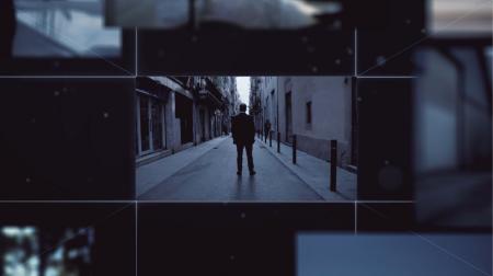 Still frame from The Pursuit launch film. A landscape, blue-hued photo of a man in a suit standing in the middle of an empty street, facing away from camera. The photo only fills the middle of the frame, with other, cut off photos surrounding it.