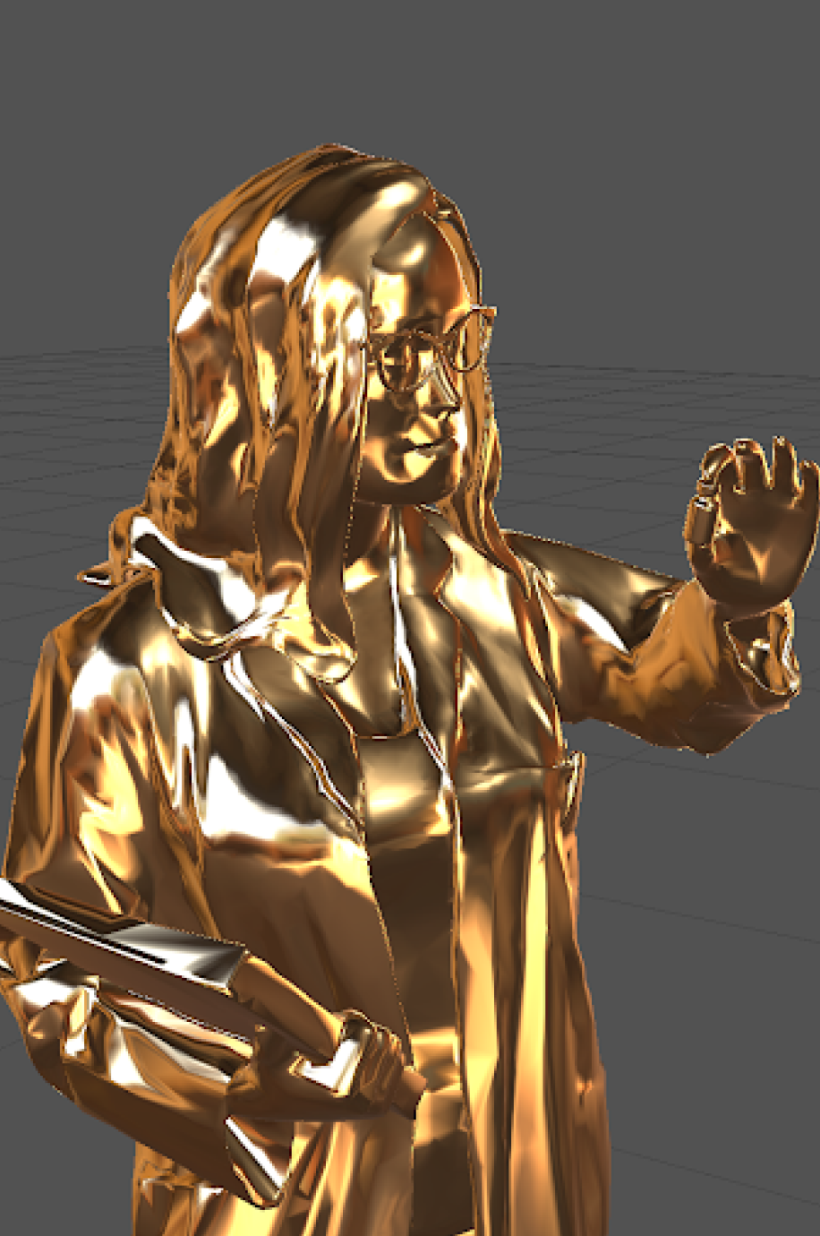 Close up of the gold statuette, showing a female scientist