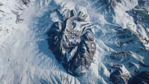 Still frame from 'Go Deeper' Launch film for SCIEX. The shape of a realistic heart is carved out of the rock face of a snowy mountain.